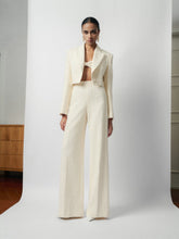 Textured wool-blend cropped jacket with peak lapels and structured shoulder tailoring